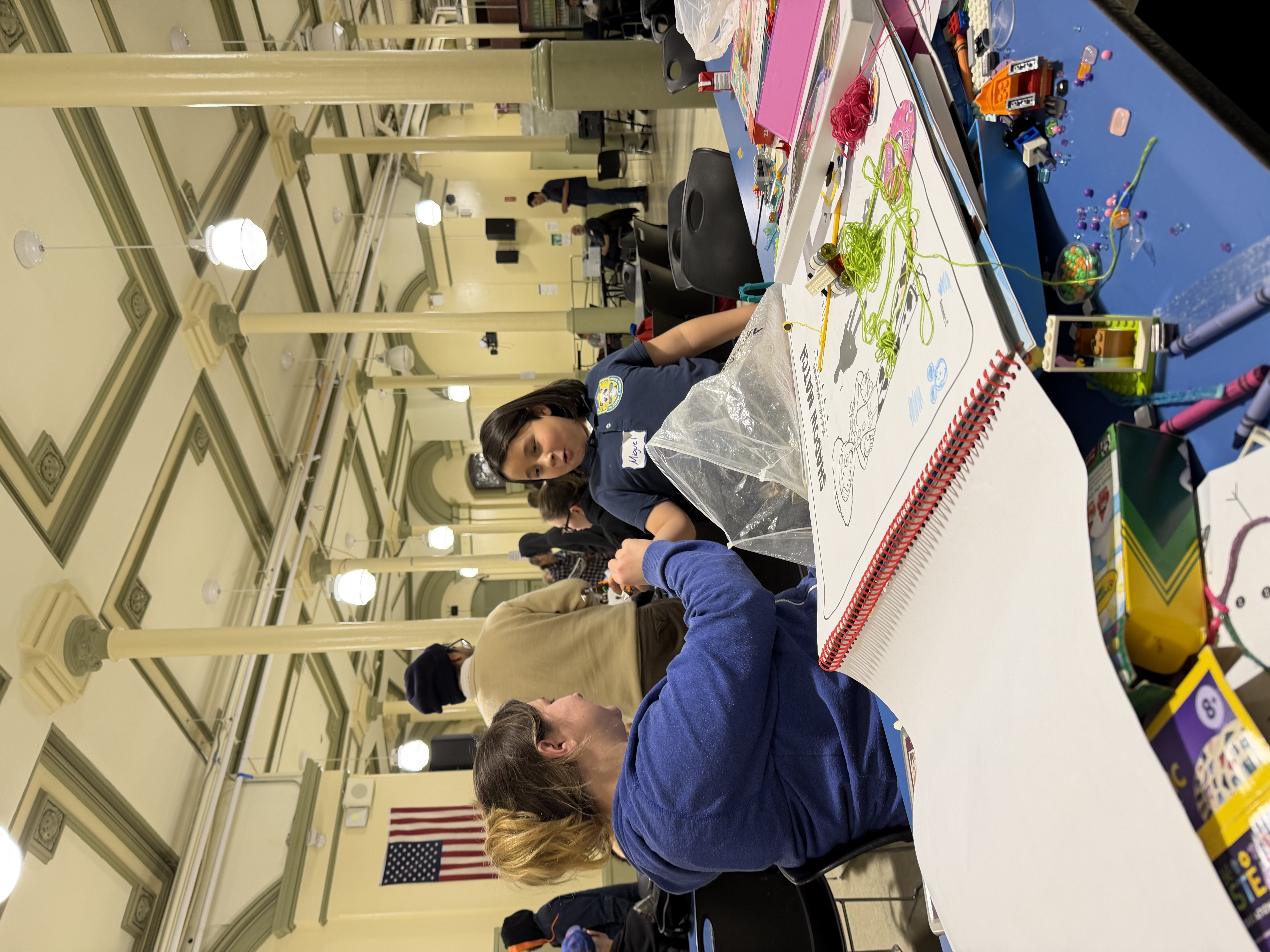 Volunteers offering translation support at the New Sanctuary Coalition