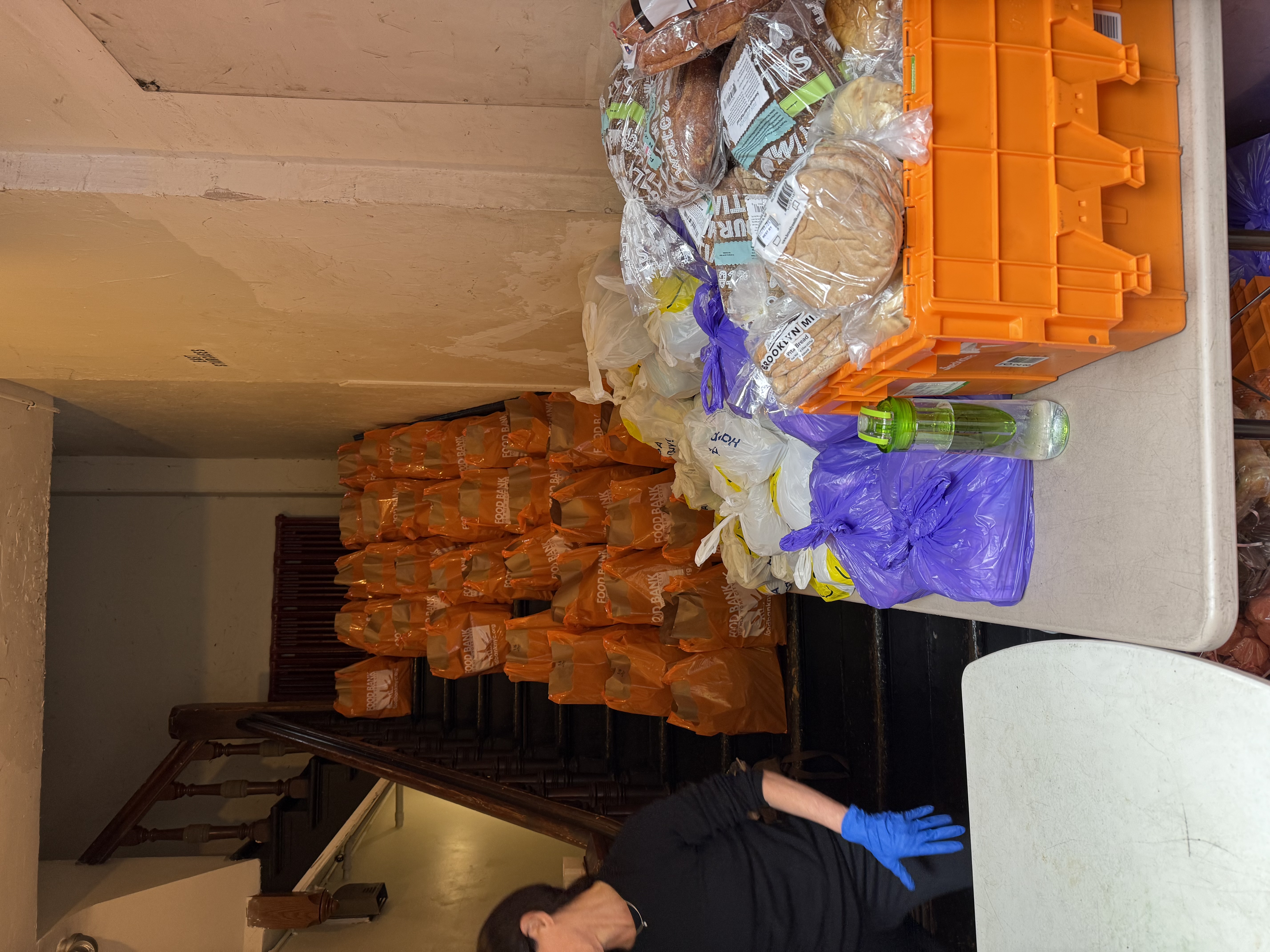 Volunteers distributing meals at St. Clement's Food Pantry