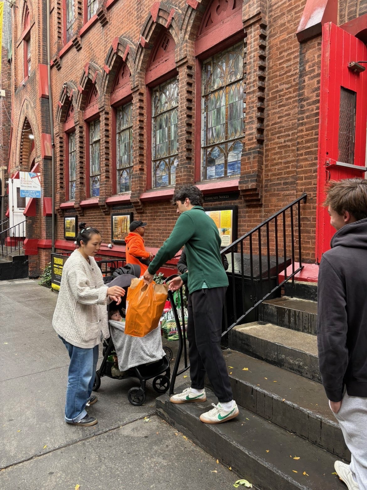 Volunteers distributing meals at St. Clement's Food Pantry